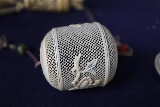 Two 19th century Chinese ivory pomanders and a similar purse